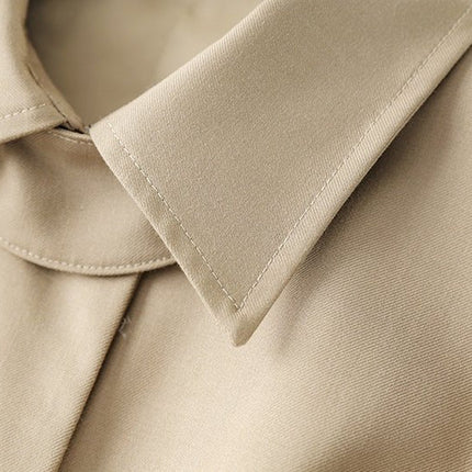 Beige oversized belted military-inspired jacket with epaulettes and adjustable cuffs