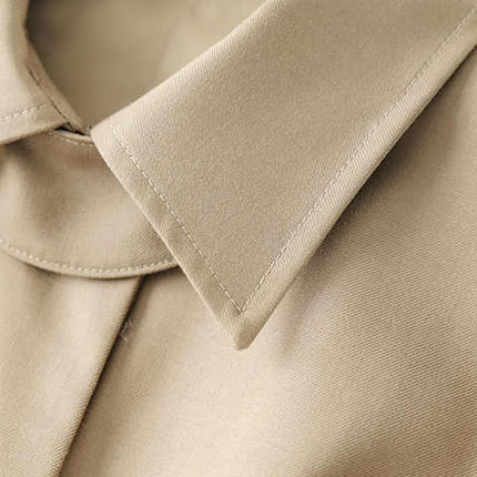 Beige oversized belted military-inspired jacket with epaulettes and adjustable cuffs