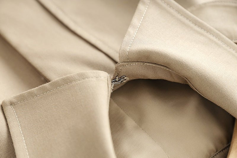 Beige oversized military-inspired jacket with adjustable cuffs