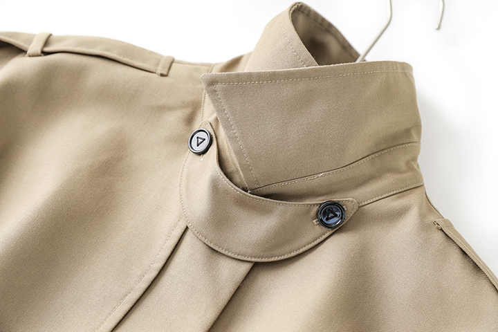 Beige oversized military-inspired jacket with adjustable cuffs