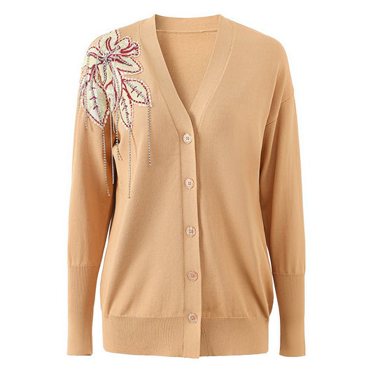 Beige V-neck cardigan with embroidered floral detail on shoulder