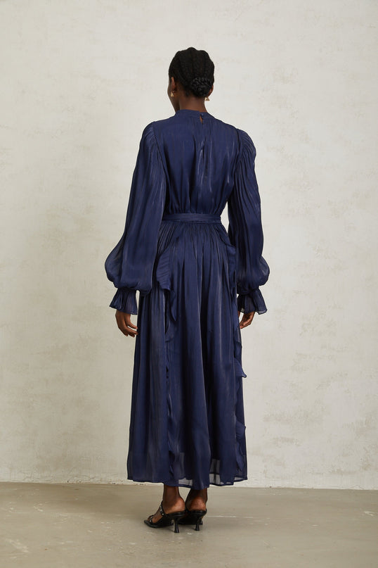 Benedetta Maxi Dress Dark Blue Ribbon Tie-Neck Puff Sleeves Ruffled Trim Glossy Finish Fully-Pleated Tied Waist Maxi Length Rear Zip Fastening Terylene Fiber