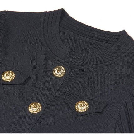 Black A-line dress with gold accents and pleated skirt