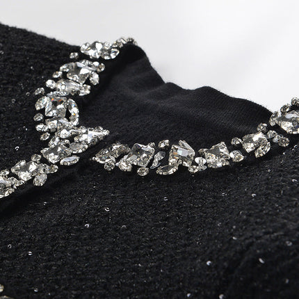 Black A-line dress with crystal embellishments on pockets
