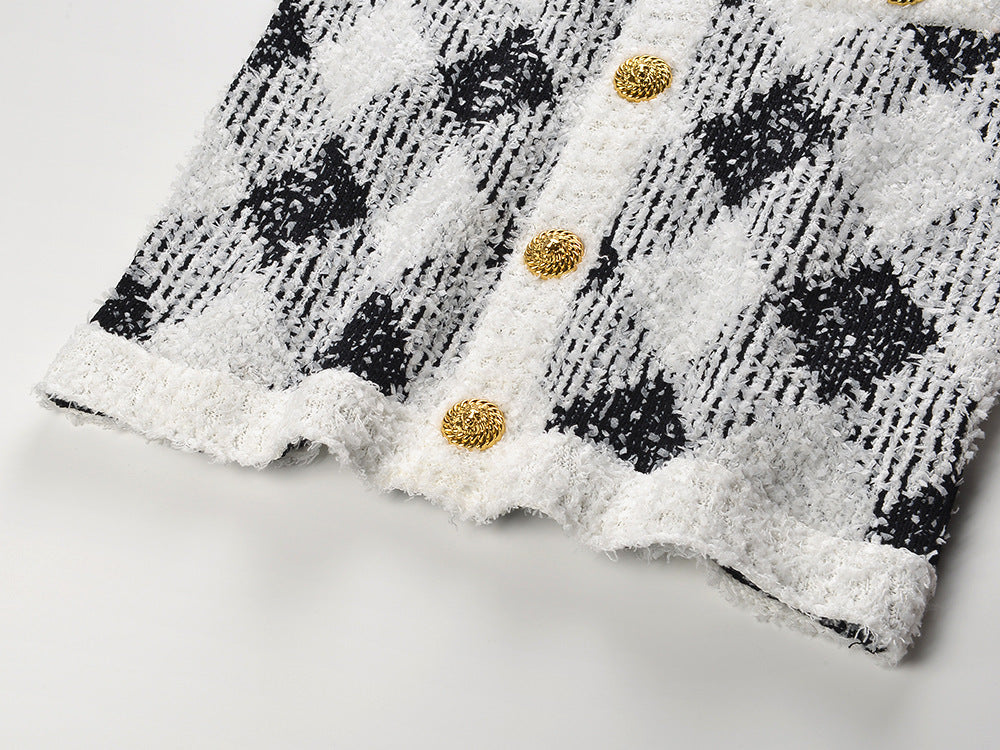 Black and white argyle pattern bodycon dress with pockets and golden button accents