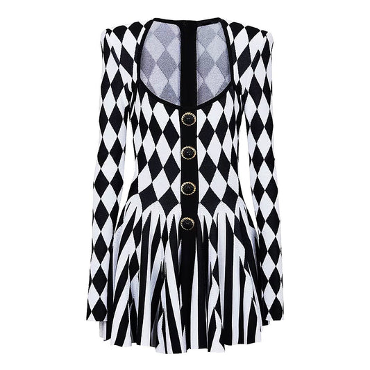 Black and white geometric harlequin pattern fitted dress with gold buttons