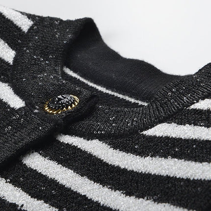 Black and white striped fitted knit cardigan with gold-tone buttons and front pockets