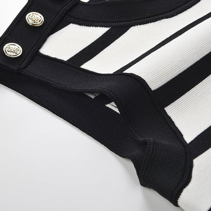 Black and white striped sleeveless body-con dress with gold button accents on shoulders