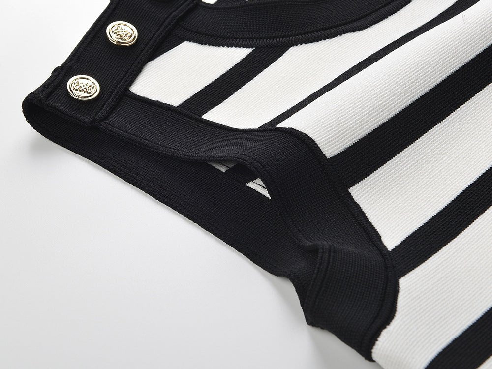 Black and white striped sleeveless body-con dress with gold button accents on shoulders
