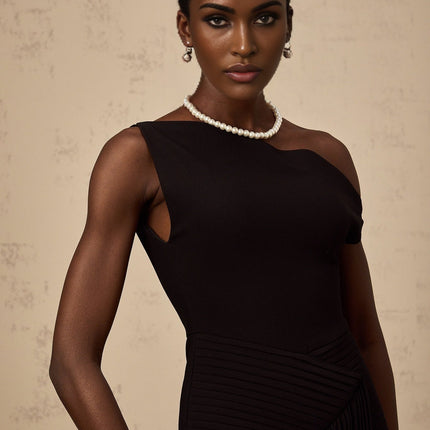 Black asymmetric draped midi dress with a flowing silhouette