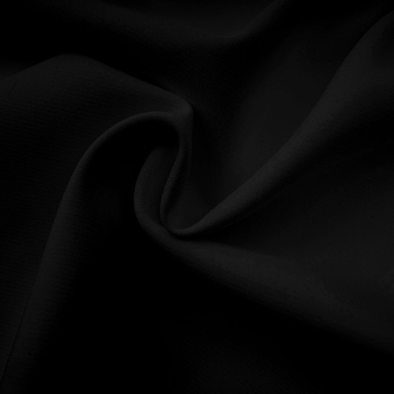 Black asymmetric tulle blouse and matching skirt set named Andrea