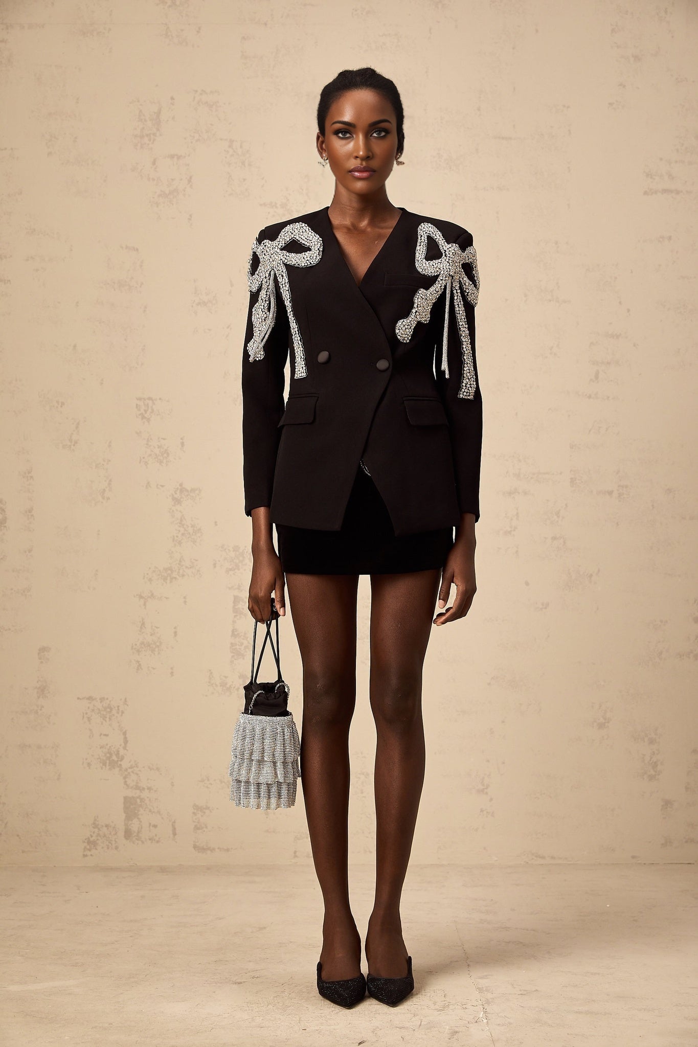 Black blazer with bow embellishments featuring Vanessa design