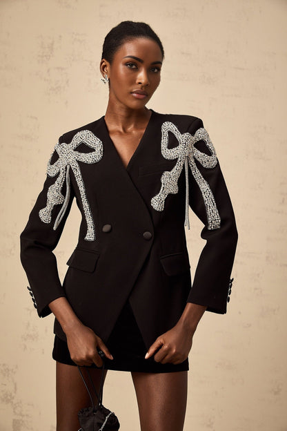 Black blazer with decorative bow motif embellishment
