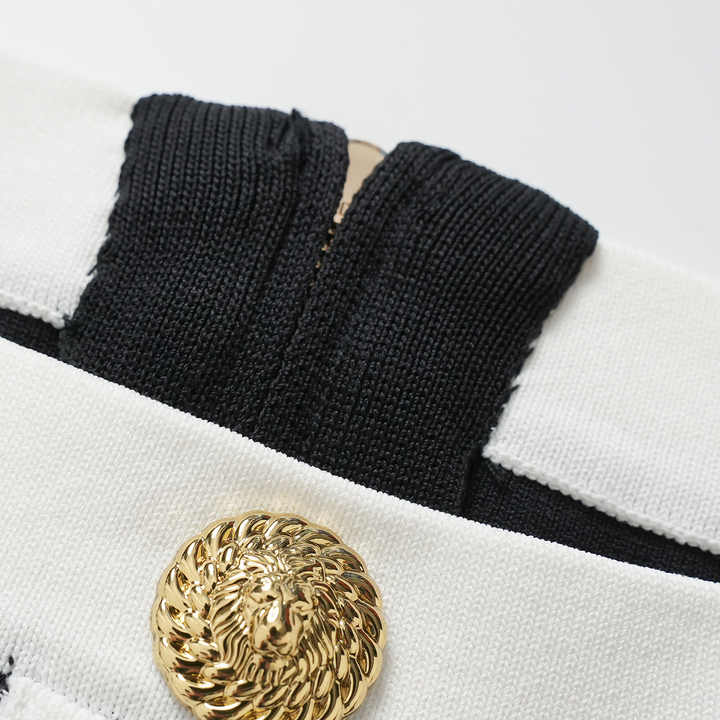 Black bodycon dress with white button accents tailored to hug curves