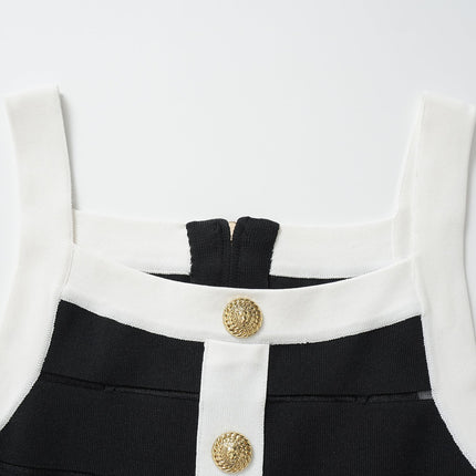 Black bodycon dress with white panel detailing and gold button embellishments