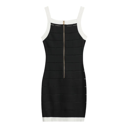 Black bodycon dress with white panel detailing and gold button embellishments