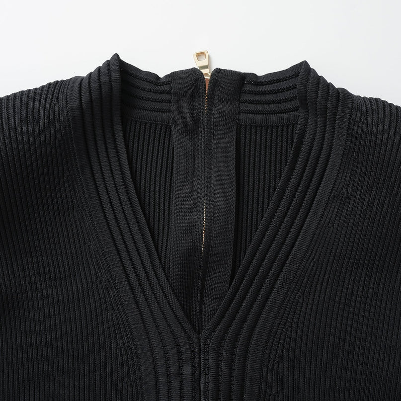 Black bodycon knit dress with ribbed texture and gold button details
