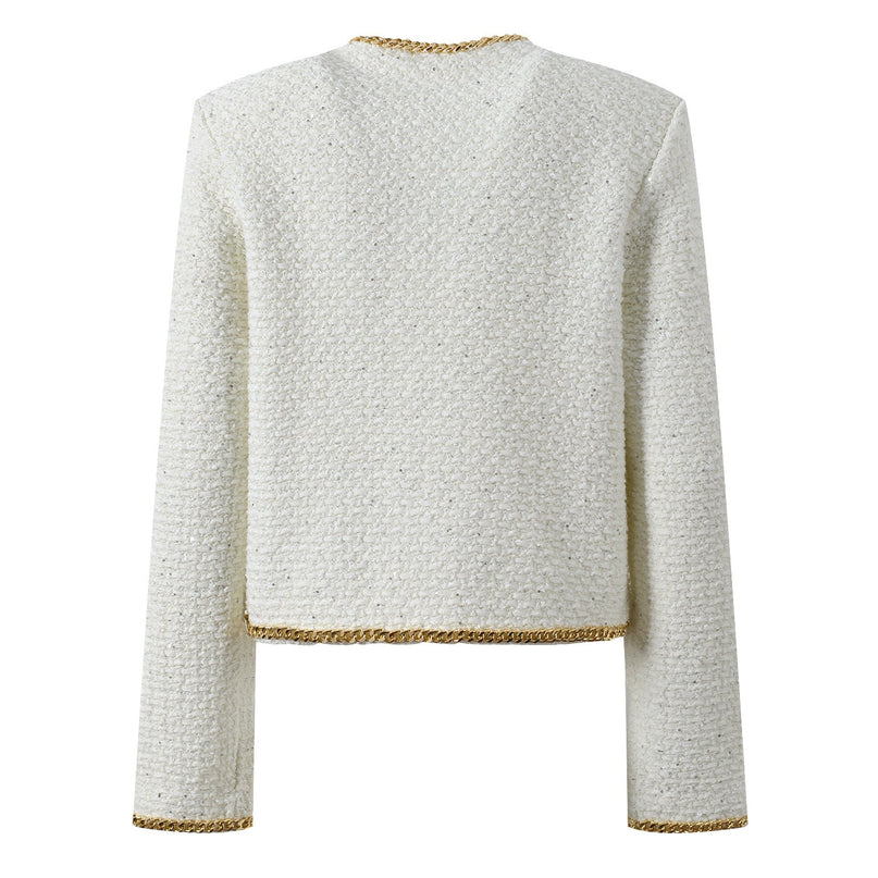 Black cropped boxy jacket with sparkling accents and gold chain trim