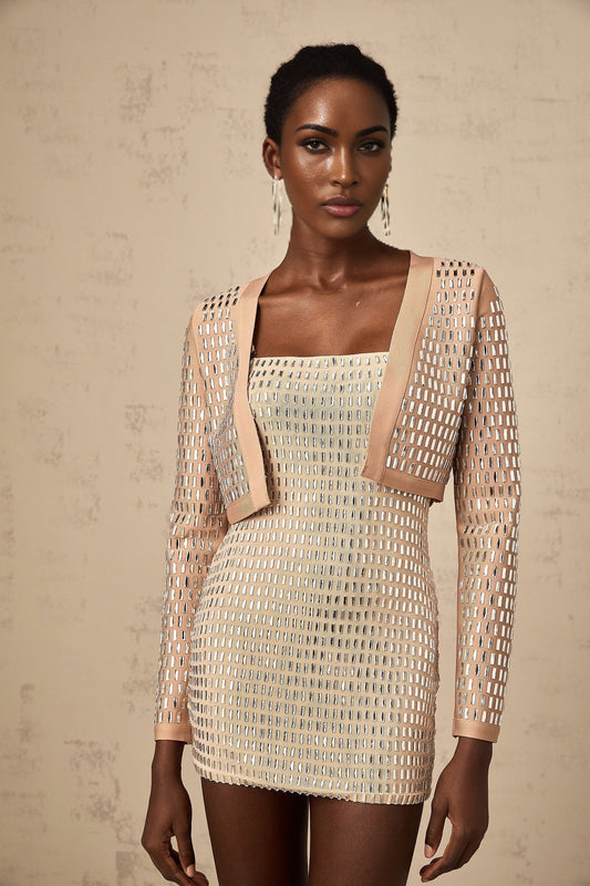 Black cropped jacket with silver stud embellishments on the collar and pockets featuring long sleeves and a front zip closure