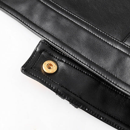 Black cropped leather jacket with gold button embellishments