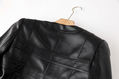 Black cropped leather jacket with gold button embellishments