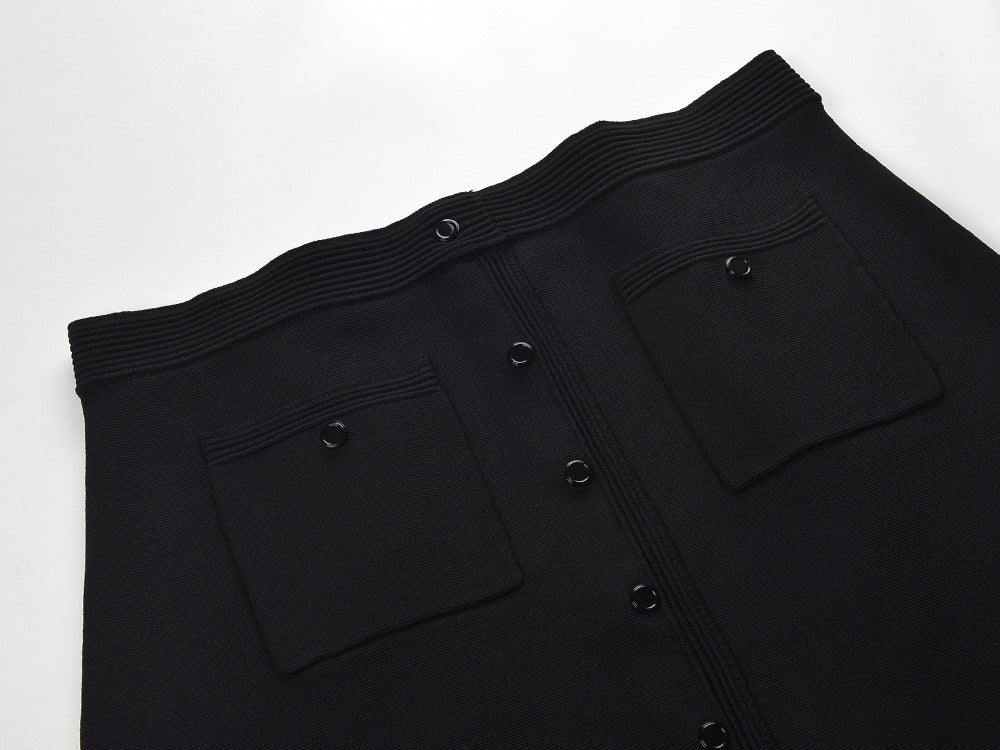 Black cropped top and flared skirt with pearl collar accent and button closure