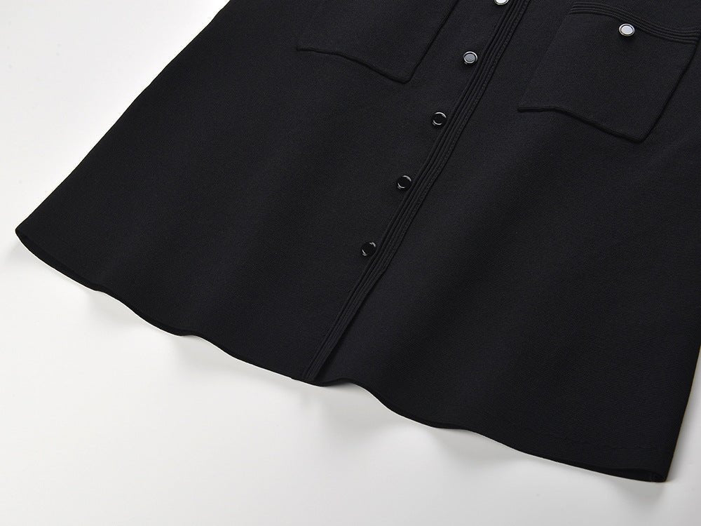 Black cropped top and flared skirt with pearl collar and button closure