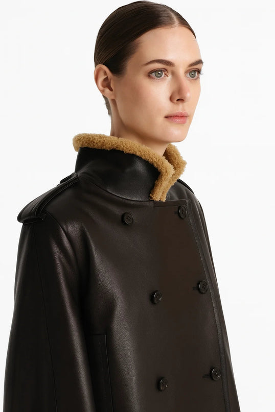 Laura wearing Black Dress Streetwear Style leather jacket with lamb fur accents