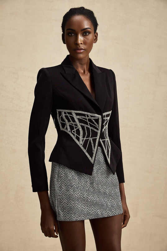 Black fitted jacket with embellished details and cinched waist design