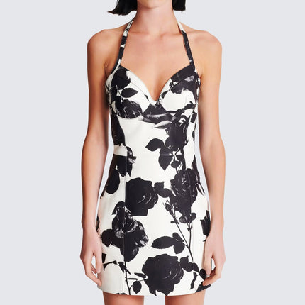 Black floral bodycon dress with halter neck on white background