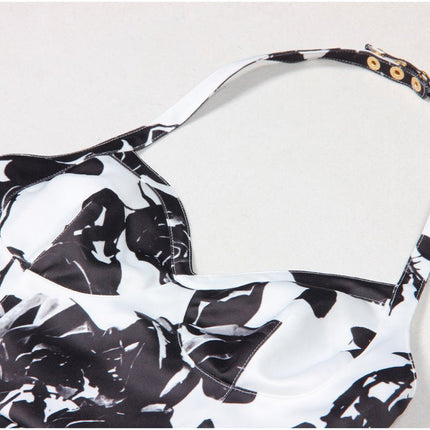 Black floral bodycon dress with halter neck on white background