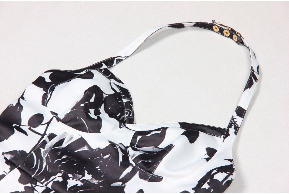 Black floral bodycon dress with halter neck on white background