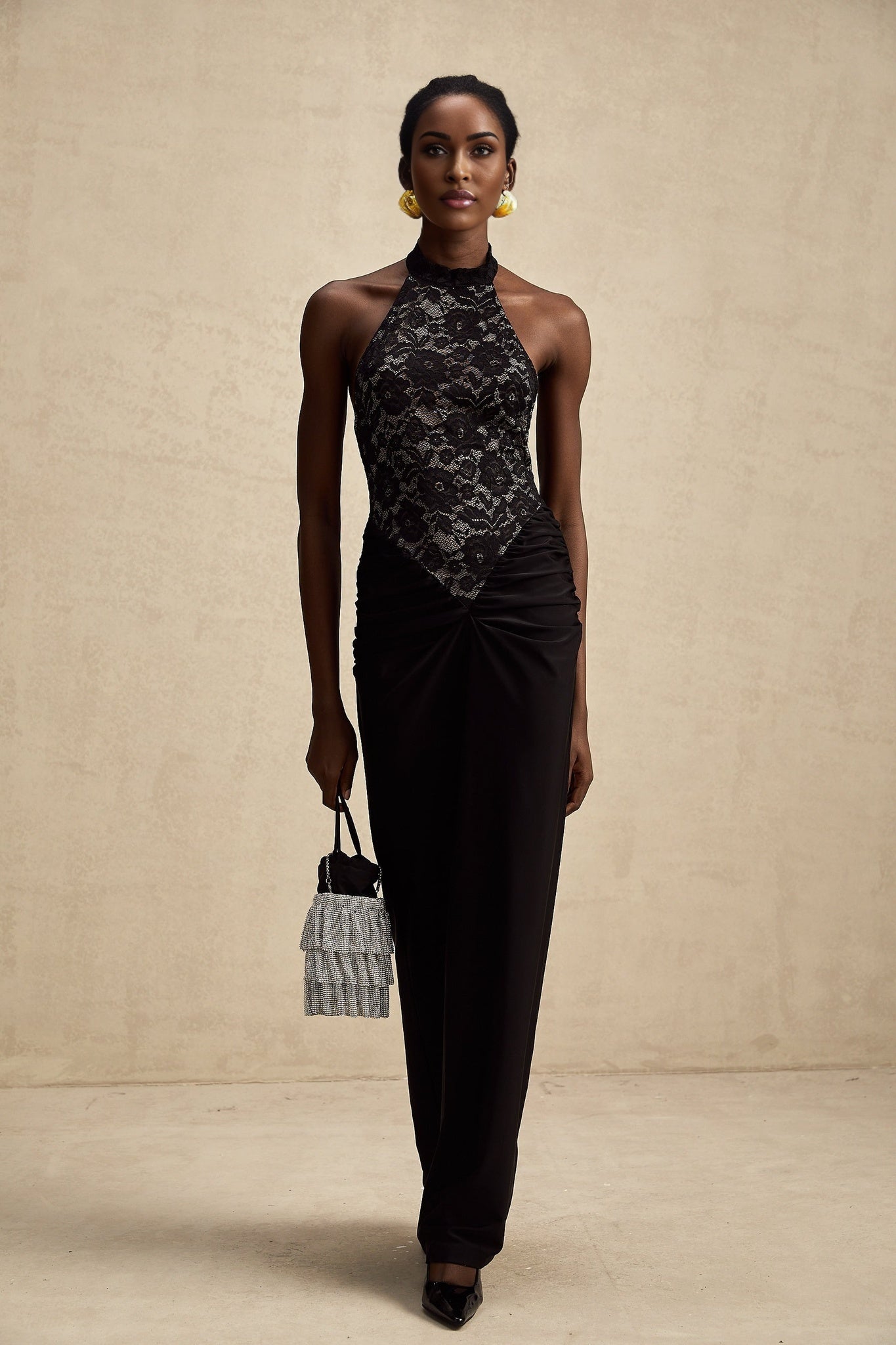 Black floral lace maxi dress with halter neckline and long flowing skirt