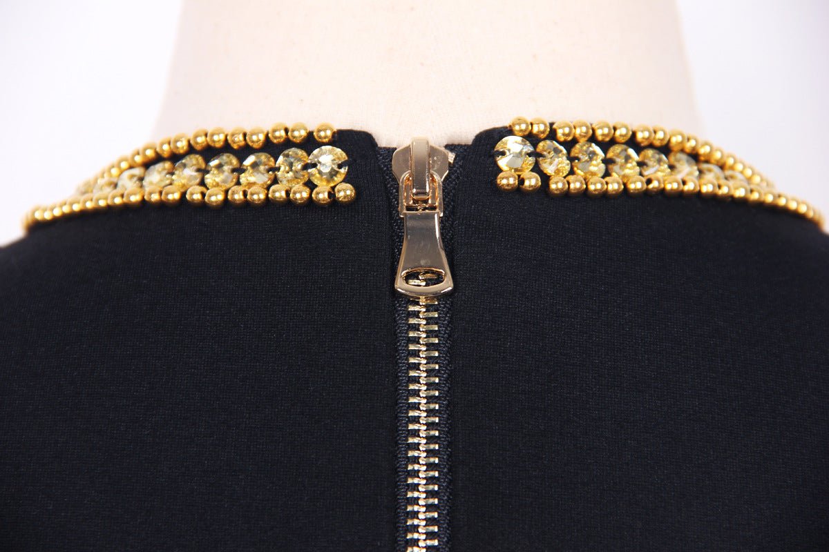 Black bodycon dress with gold sequin fringe