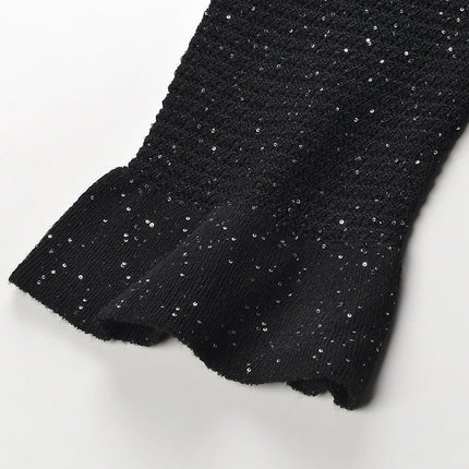 Black knit shirt jacket with gold button embellishments