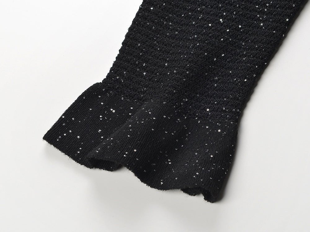 Black knit shirt jacket with gold button embellishments