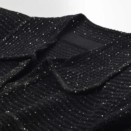 Black knit shirt jacket with gold button embellishments