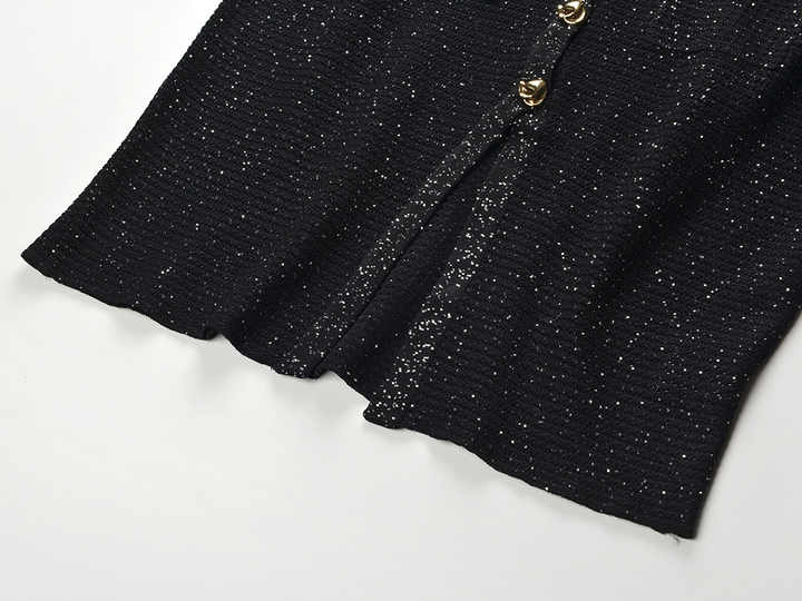 Black knit shirt jacket with gold button embellishments