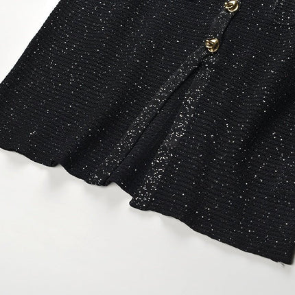 Black knit shirt jacket with gold button embellishments