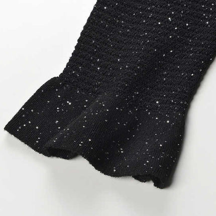Black knit shirt jacket with gold button embellishments