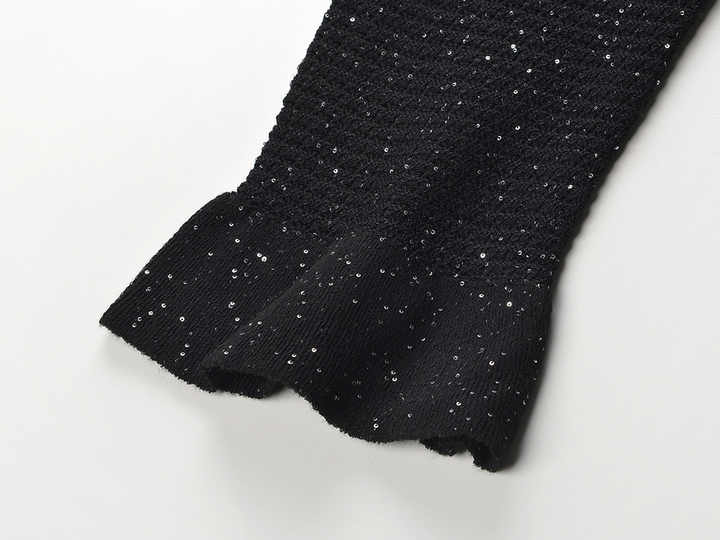 Black knit shirt jacket with gold button embellishments