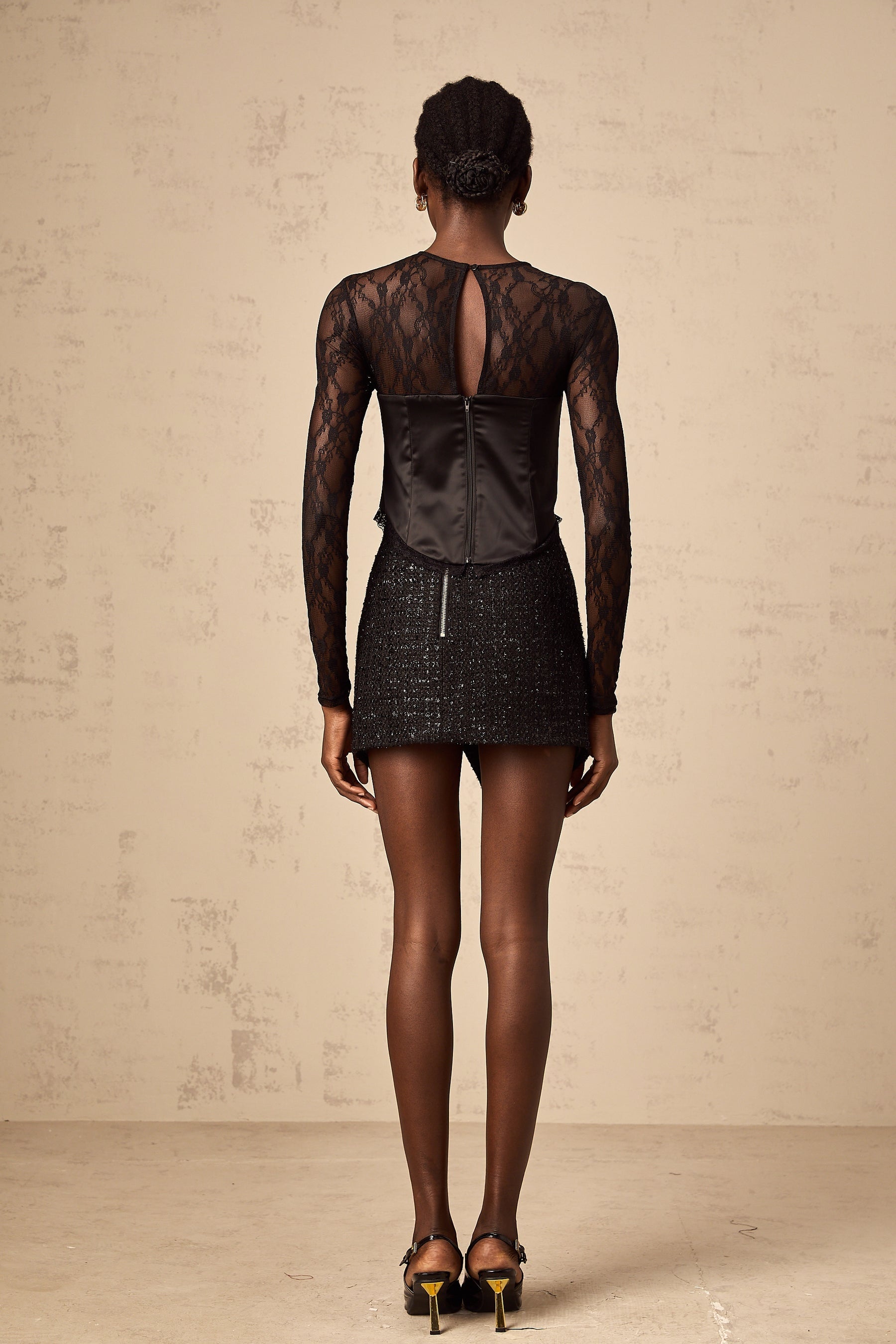Black lace top with cutout details short sleeves and scoop neckline
