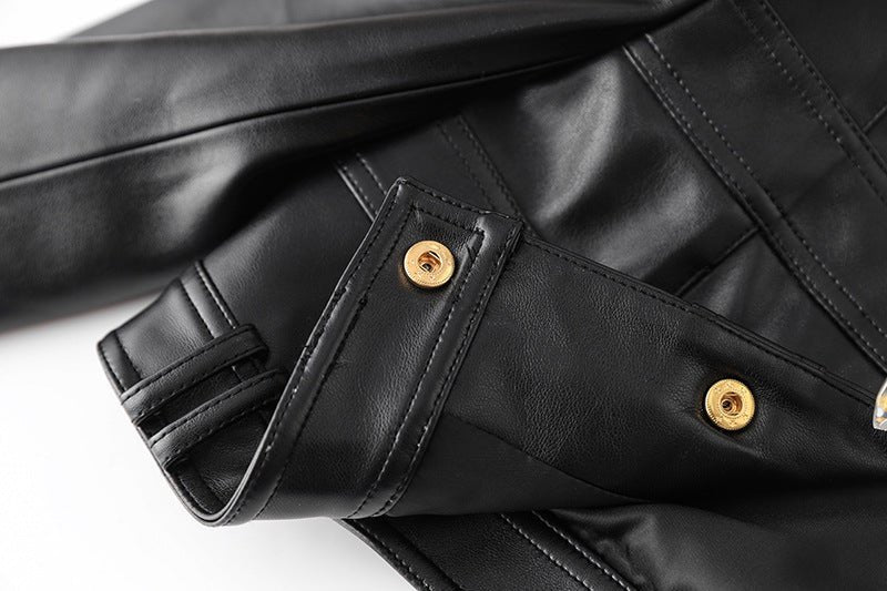 Black leather cropped jacket with gold button embellishments