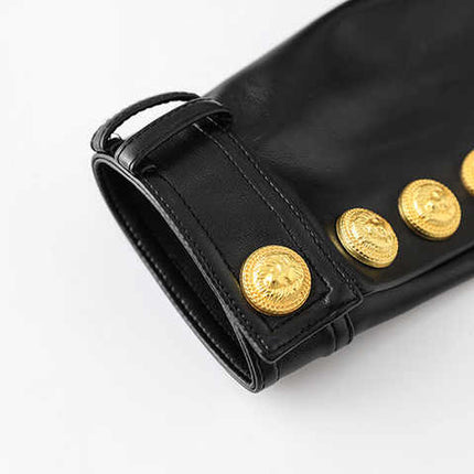 Black leather cropped jacket with gold button embellishments