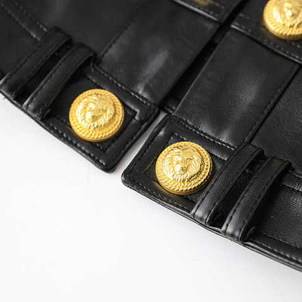 Black leather cropped jacket with gold button embellishments