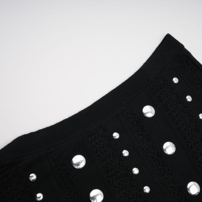 Black maxi dress with crochet knit design and stud embellishments by Chloe