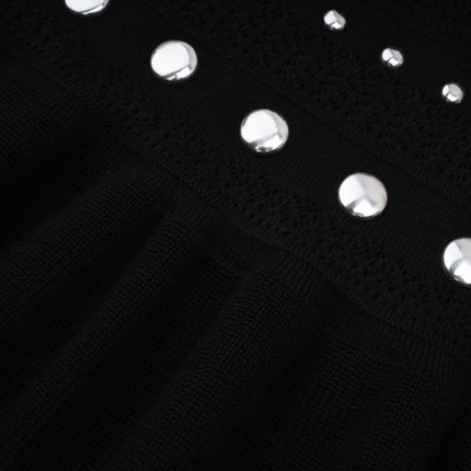 Black maxi dress with crochet knit pattern and stud embellishments by Chloe