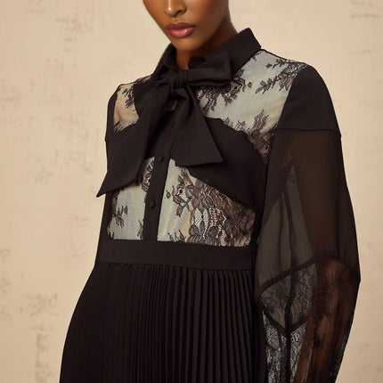 Black maxi dress with floral lace panels and pleated design named Segolene