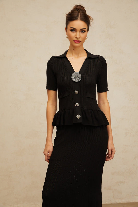 Black midi dress with embellished pointelle knit design and feminine silhouette