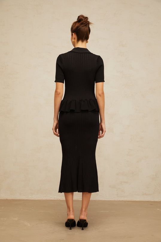 Black midi dress with embellished pointelle knit pattern and intricate detailing